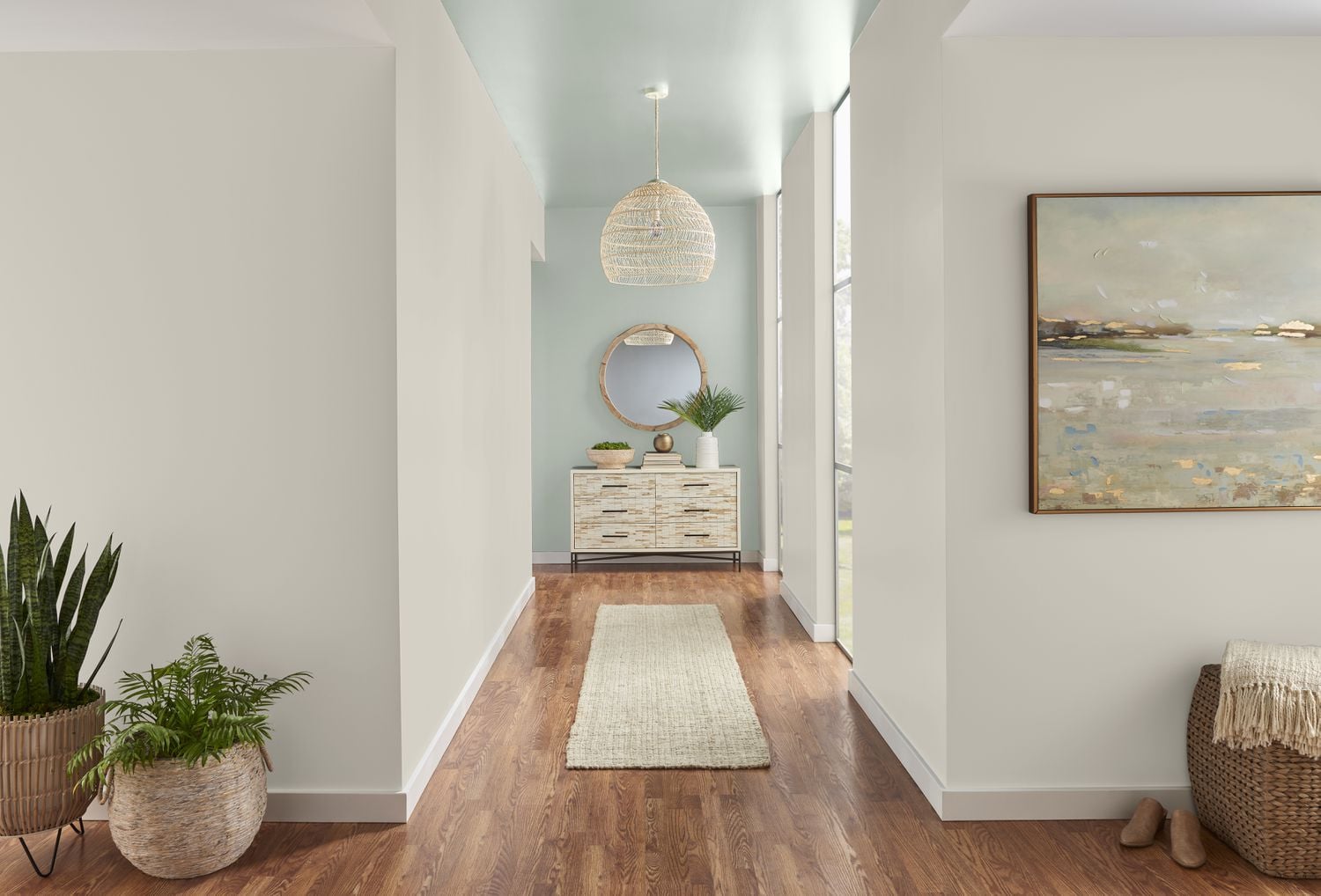 Hallway and stairway with freshly painted walls and sharp white trim detail